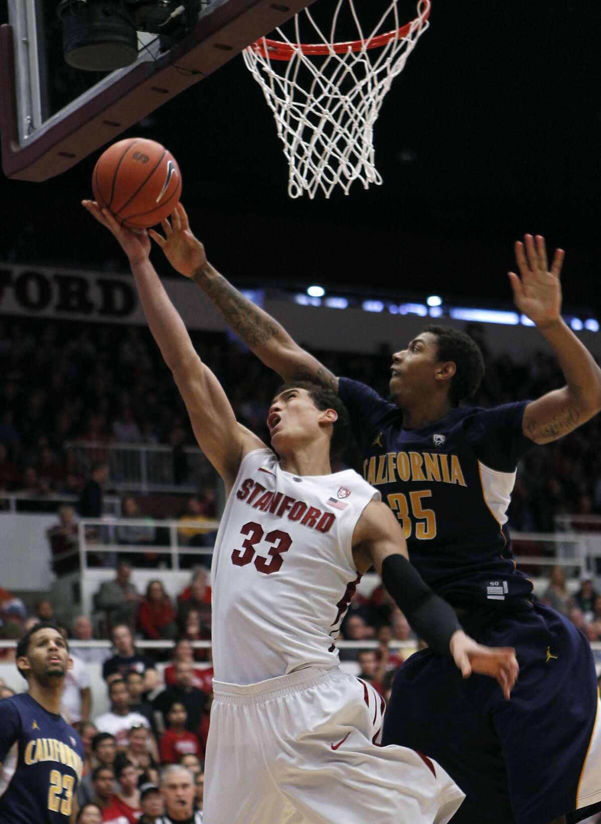 Cal's Richard Solomon (35) denies Stanford's Dwight Powell of a basket in the second half of Stanford's 69-59 win over Cal at Maples Pavilion in Stanford, Calif. on Saturday, Jan. 19, 2013.