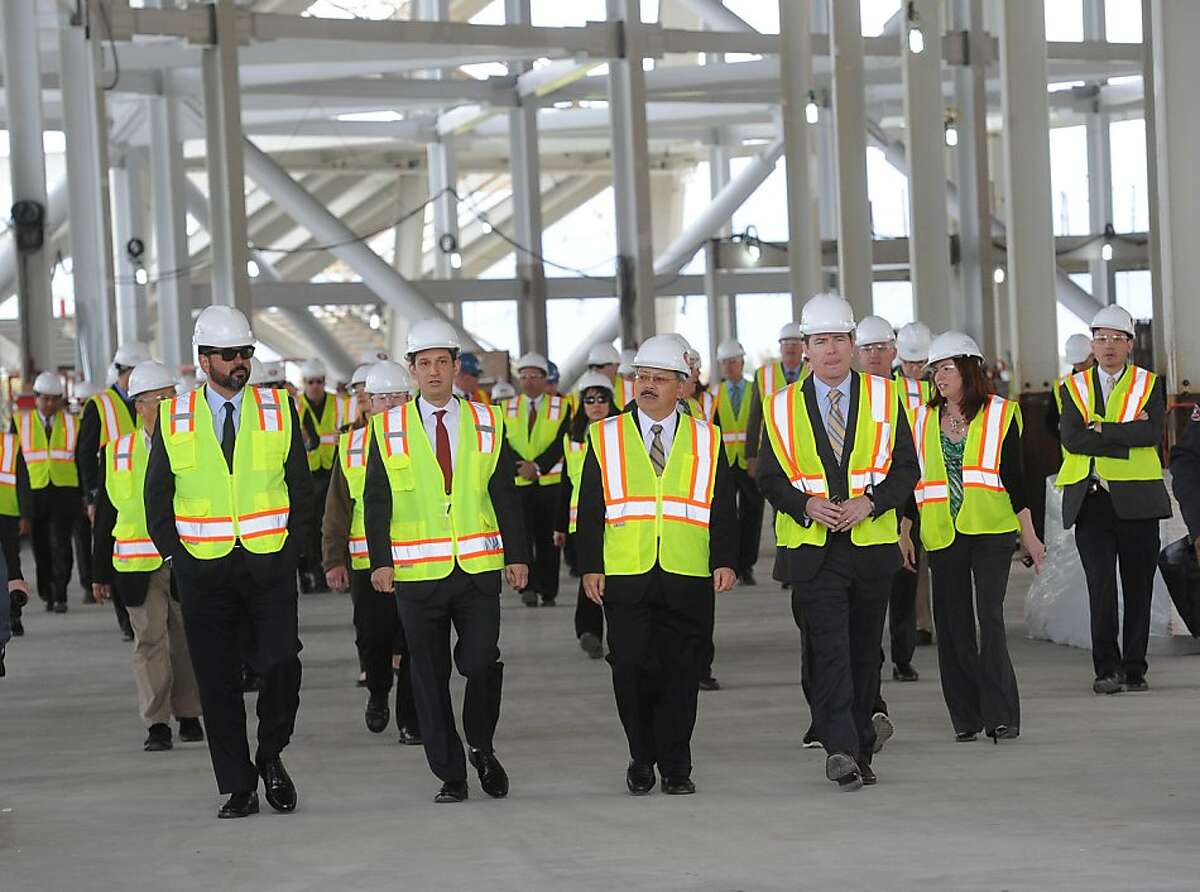 Second From left: Daniel Lurie, Mayor Ed Lee and others walk to meet with the media at the new 49er's stadium in Santa Clara to discuss the bid for the Super Bowl.