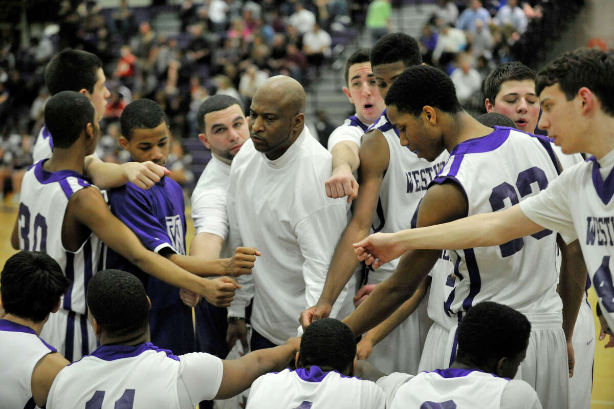 Westhill head coach Howard White talks to his team during a break in the action in their game against Newtown at Westhill High School on Wednesday, March 6, 2013.