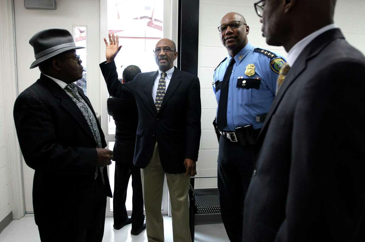 Director of the Houston Center for Sobriety, Leonard Kincaid, center, takes Houston Police Chief Charles McClelland and others on a tour of the new "sobering center."