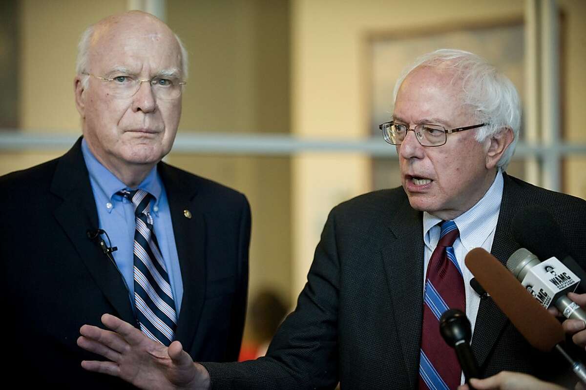 U.S. Sens. Patrick Leahy (D-Vt.) and Bernie Sanders (I-Vt.) address concerns about FEMA aid during a news conference at Burlington International Airport in South Burlington, Vt., on Monday, Sept. 26, 2011, before flying to Washington to vote on a bill to release new money for the Federal Emergency Management Agency after Hurricane Irene. (AP Photo/Burlington Free Press, Emily McManamy) NO SALES; MAGS OUT