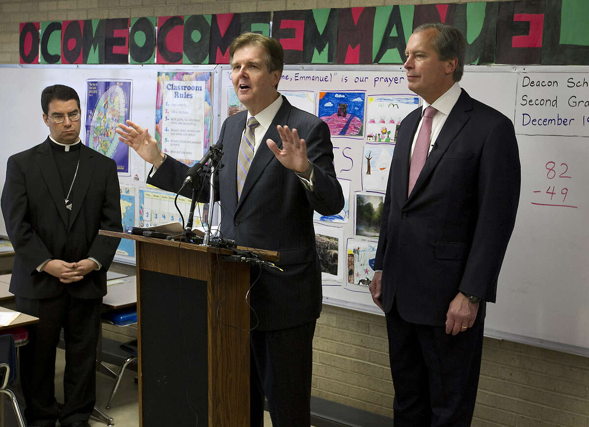 Texas Senate Education Chairman Dan Patrick (center) speaks recently at the Cathedral School of Saint Mary in Austin as Lt. Gov. David Dewhurst and Bishop Oscar Cantu listen.