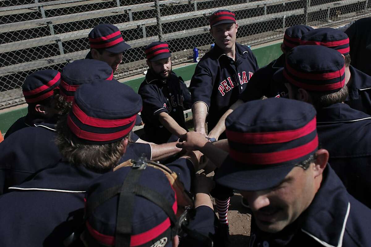 Members of the San Francisco Pelicans huddle before a game of vintage baseball against the San Francisco Pacifics in Golden Gate Park on Sunday, March 10. Vintage baseball captures the spirit of the game in the 1880s by using the same equipment and rules.