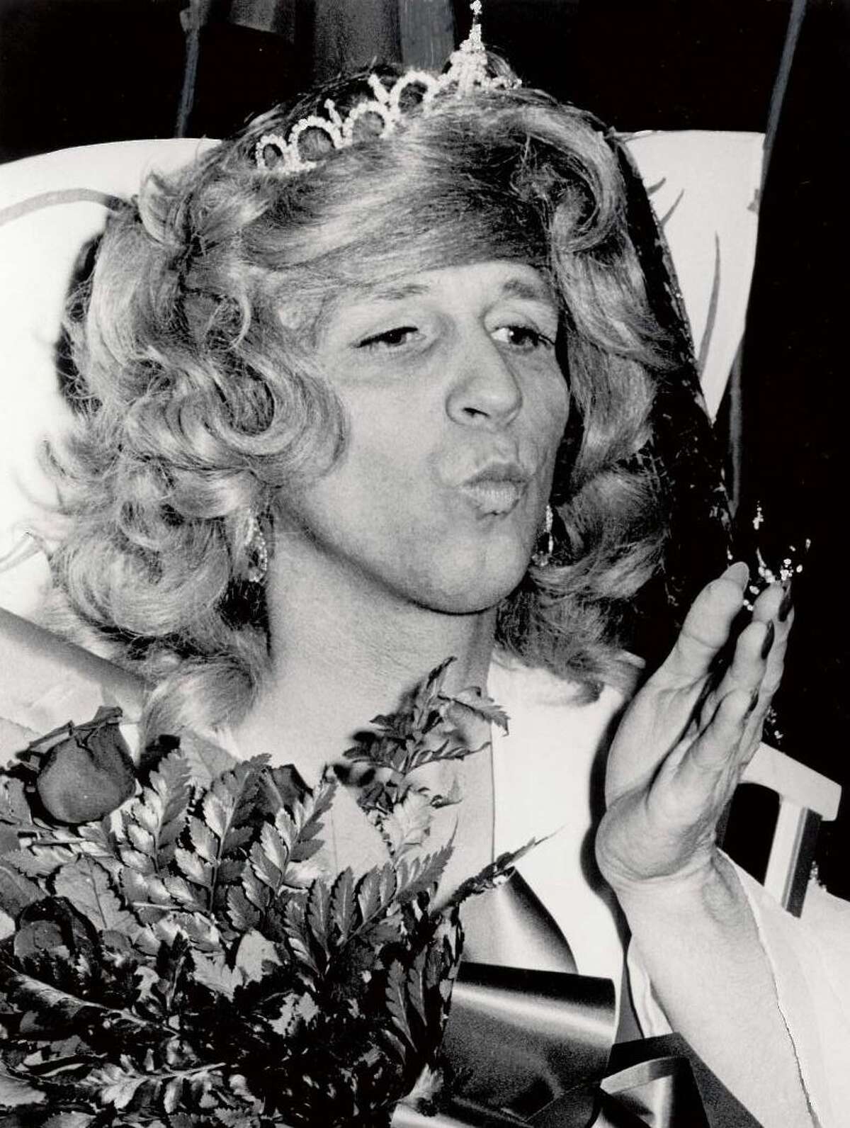 Lovely golden brown locks on realtor Bill Schroter's shapely legs won the hearts of judges, who named him Mock Miss America at the 1976 Nederland Heritage Festival.