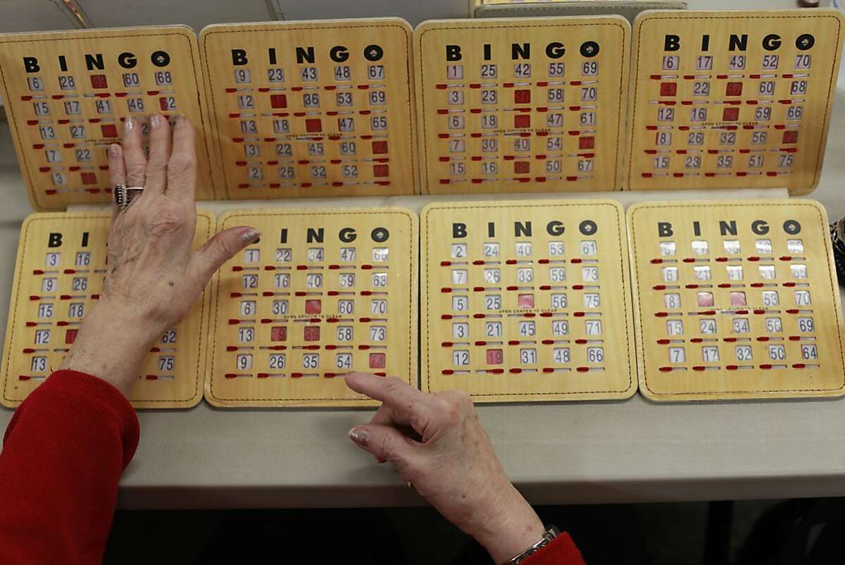 Months after receiving a surgery at Stanford that cured a rare disease called achalasia which prevented her from eat solid food for months, Marjorie McFadden, 91, plays BINGO at the Delhi Senior center on Wed. March 6, 2013 in Delhi, Calif.