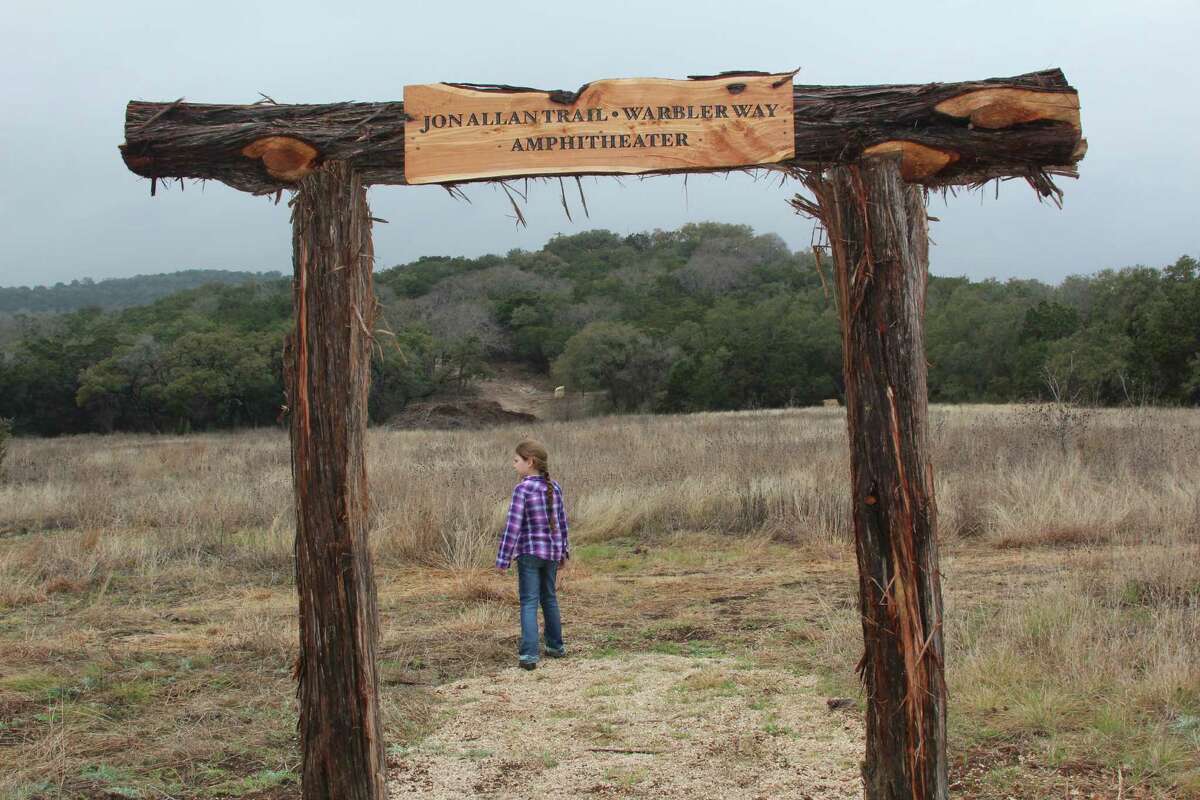 Trailhead signage pays tribute to the late Jon Allan, former mayor of Helotes, who instigated the idea of a park to pay tribute to the late Sen. Frank L. Madla Jr., who was raised in Helotes.