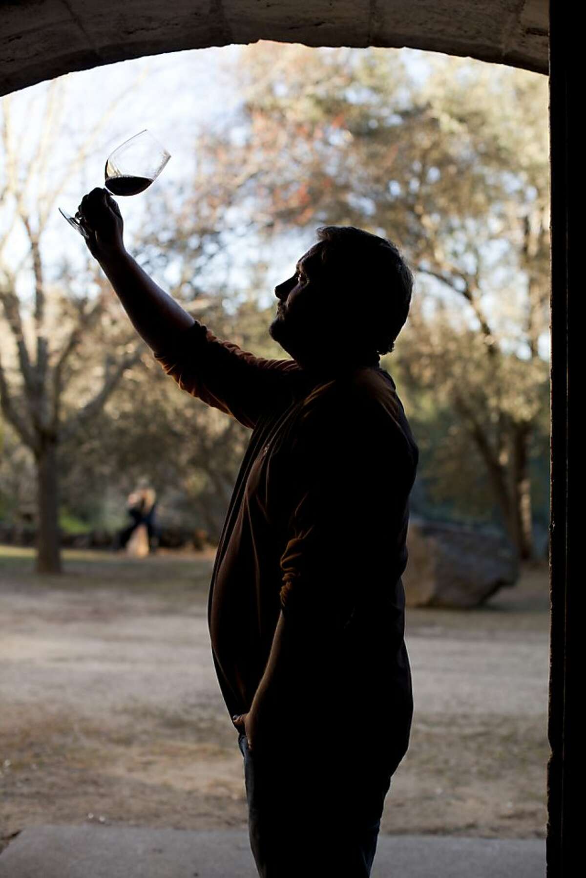 Chris Travers, part owner of Mayacamas Vineyards, built in 1889 by John Henry Fisher, inspects a 1991 cabernet sauvignon on Mount Veeder, Calif., Friday, March 8, 2013.