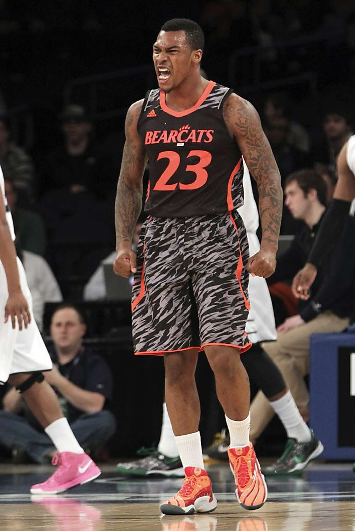 Cincinnati's Sean Kilpatrick reacts after making a basket during the first half of an NCAA college basketball game against Providence at the Big East Conference tournament, Wednesday, March 13, 2013 in New York. (AP Photo/Mary Altaffer)