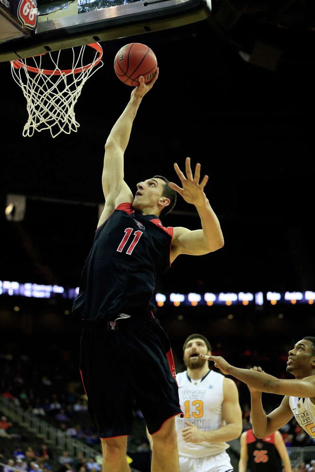 KANSAS CITY, MO - MARCH 13: Dejan Kravic #11 of the Texas Tech Red Raiders shoots during the game as the Red Raiders defeat the West Virginia Mountaineers 71-69 to win their first round game of the 2013 Big 12 Men's Basketball Championship at Sprint Center on March 13, 2013 in Kansas City, Missouri. (Photo by Jamie Squire/Getty Images)