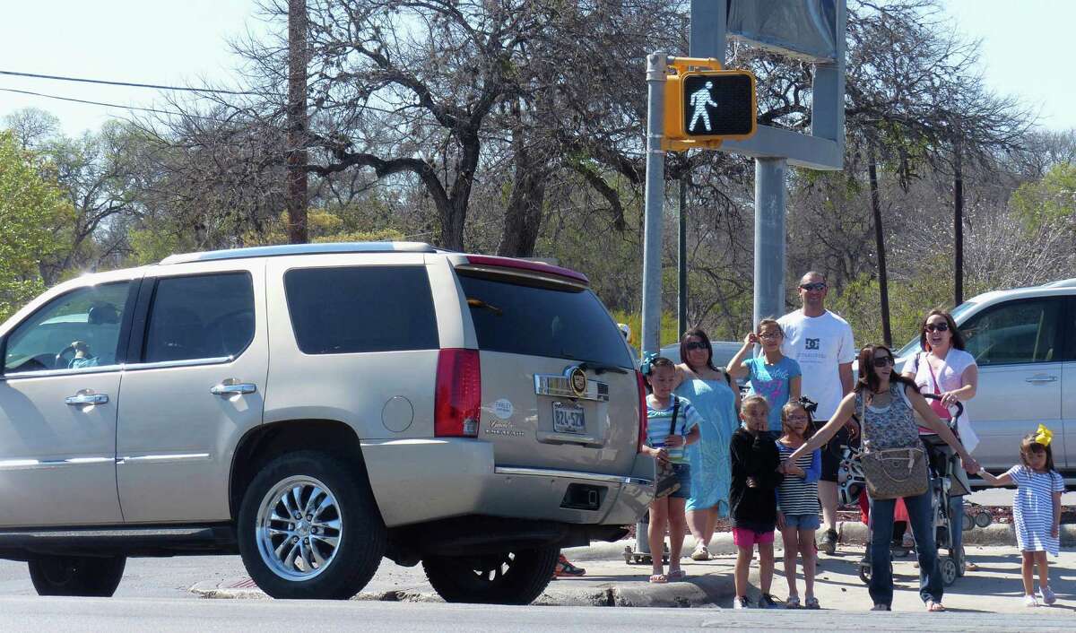 People cross the intersection at Broadway and Mulberry on Wednesday, March 13, 2013. The presence of Brackenridge Park, Kitty Park and the Lions Field playground in the area, coupled with the rerouting of traffic that would normally travel on Hildebrand to Mulberry, have caused congestion.