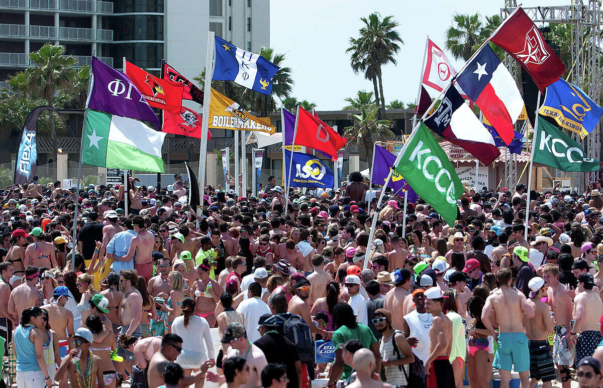 Flags of different universities and organizations were on display during spring break on Tuesday, Mar. 12, 2013 at South Padre Island, Texas. (AP Photo/The Brownsville Herald, Paul Chouy)