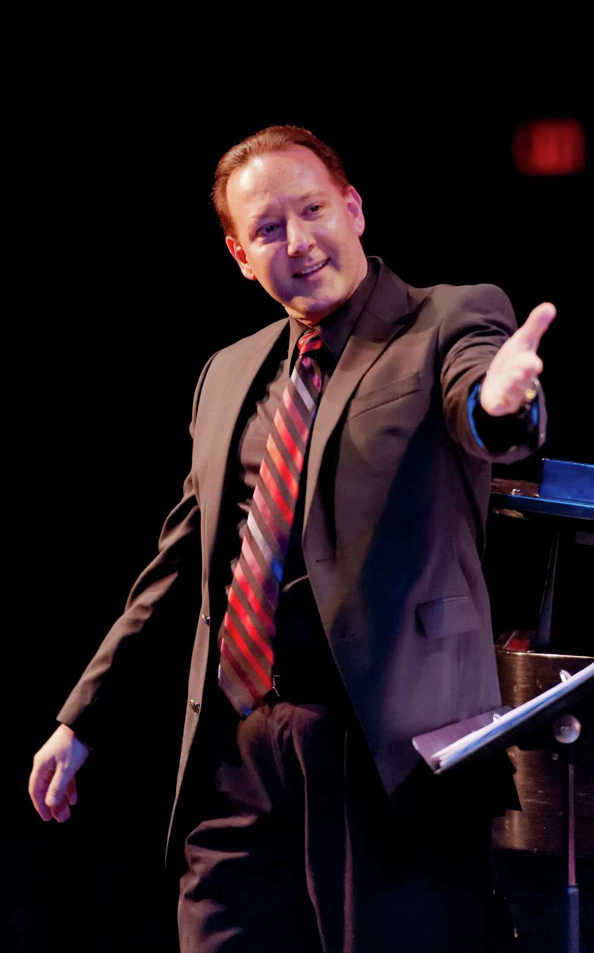 Galen Tate, assistant director of Sacred Heart University's choral ensembles, will be one of the conductors of "How Can I Keep From Singing?" concert Saturday, March 23, on campus in Fairfield.