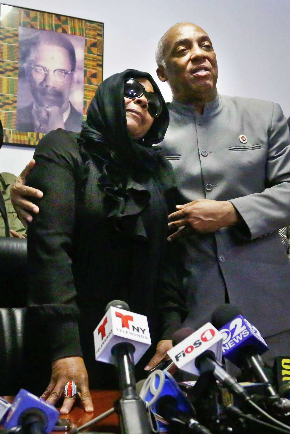 Carol Gray, left, leans on City Councilman Charles Barron, during a press conference on Thursday, March 14, 2013 in the East Flatbush neighborhood of Brooklyn, N.Y. Gray's son Kimani "Kiki" Gray, 16, was shot to death on a Brooklyn street last Saturday night by plainclothes police officers who say the youth pointed a .38-caliber revolver at them, while Gray's family says he was unarmed. (AP Photo/Bebeto Matthews)