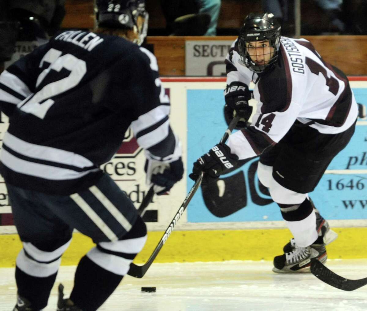 Union's Shayne Gostisbehere (14), right, works to get by Yale's Tommy Fallen (22) during their hockey game on Friday, Feb. 15, 2013, at Union College in Schenectady, N.Y. (Cindy Schultz / Times Union)