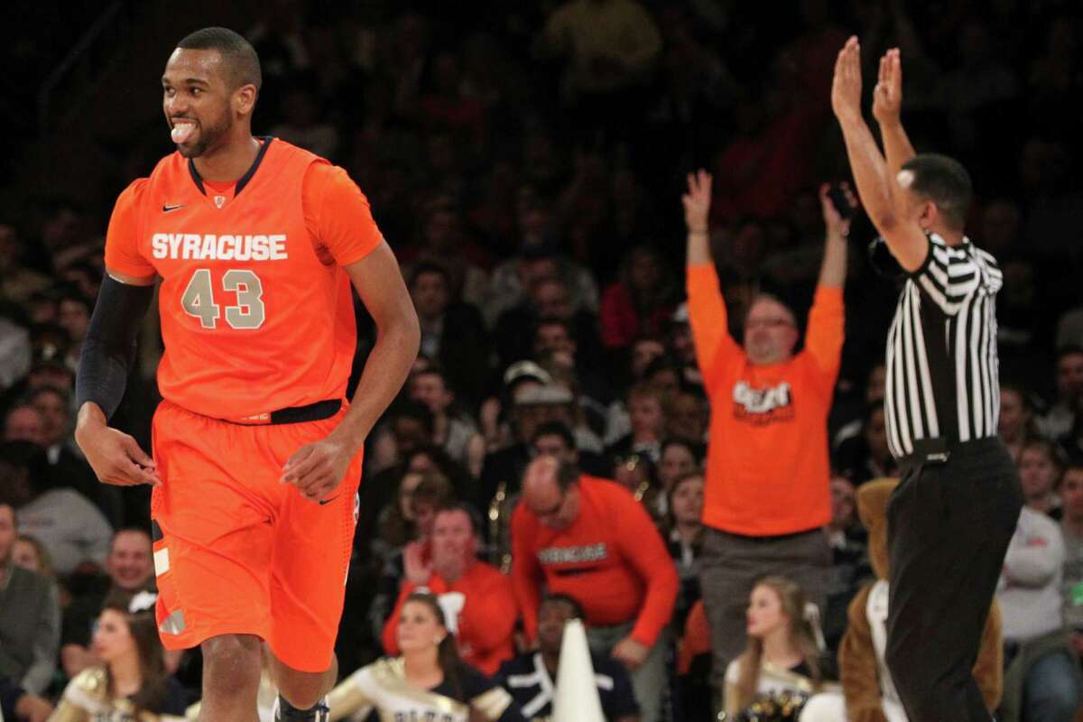 Syracuse's James Southerland reacts after scoring during the first half of an NCAA college basketball game against Pittsburgh at the Big East Conference tournament, Thursday, March 14, 2013 in New York. (AP Photo/Mary Altaffer)