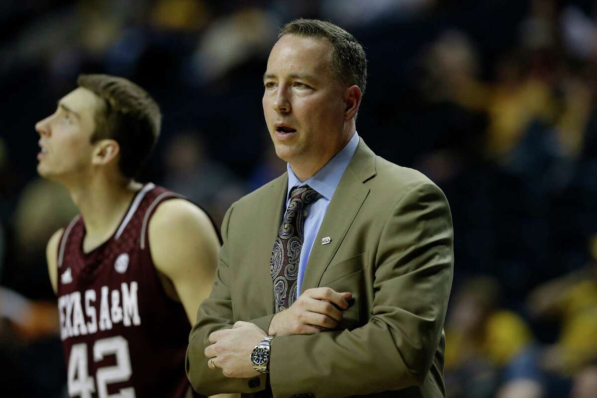 Texas A&M head coach Billy Kennedy watches play as Texas A&M forward Jarod Jahns (42) looks on during the second half of an NCAA college basketball game against the Missouri at the Southeastern Conference tournament, Friday, March 15, 2013, in Nashville, Tenn. (AP Photo/Dave Martin)