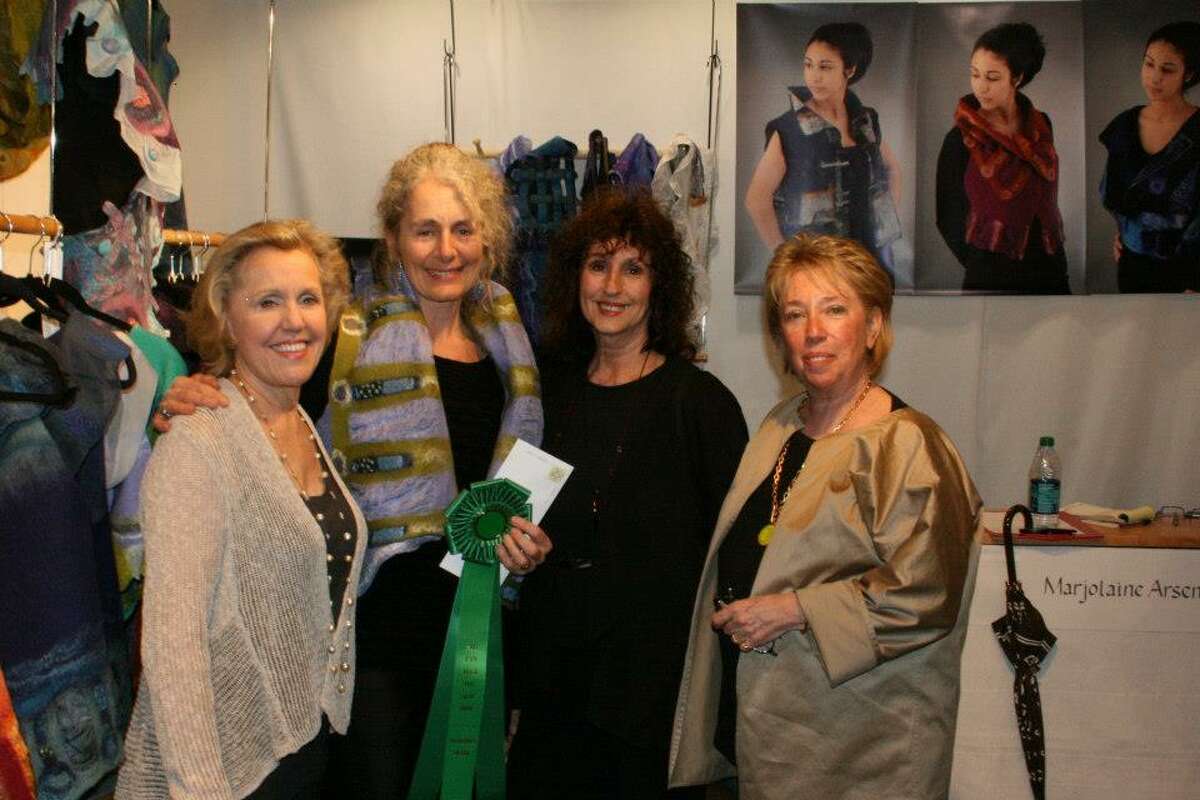 Wearable art designer Marjolaine Arsenault (second from left) of Chestertown poses with Palm Beach Fine Craft Show organizer Elizabeth Kubie (left) and award judges Betty Wilson and Dale Anderson. (Marjolaine Arsenault)