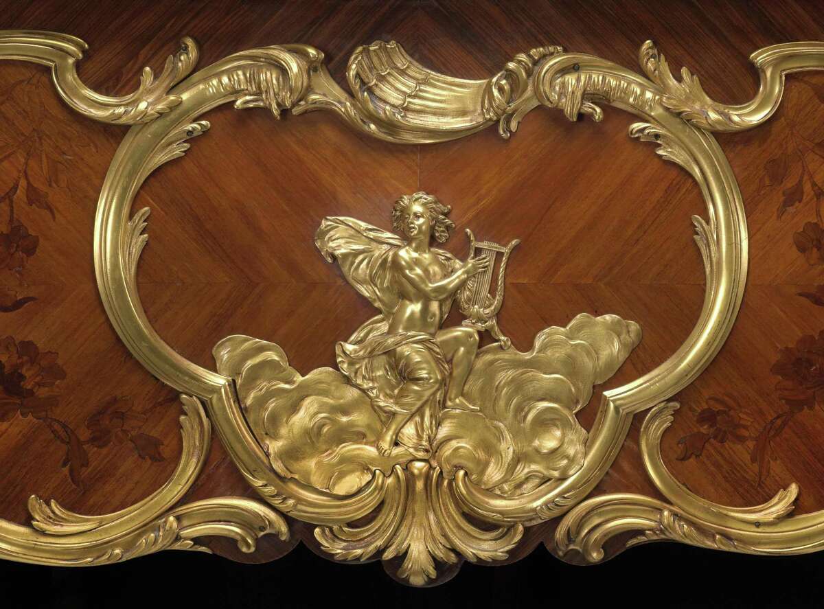 A very fine and historical Louis XV style gilt bronze mounted kingwood and marquetry Steinway art case piano Model L, Serial No. 23914; Case No. C3264 1924-1925 A notable example of exquisite partnering of the finest marquetry inlay and boldly conceived gilt bronze mounts. The harp form top inlaid a quatre faces with a foliate vine sinuously entwining the cross banding and encircling a ribbon tied lute and trumpet trophy, the keyboard flanked by substantial acanthus and rocaille mounts, the case sides with foliate reeded mounts centering ribbon tied musical trophies above a circlet of laurel, and gilt putto musicians strumming lyres perched on billowing clouds, the cabriole legs adorned with acanthus scrolled mounts headed by a floral garland ending in foliate sabots. height 40in (102cm); width 82in (208cm); depth 60in (152cm) Est. $60,000-80,000