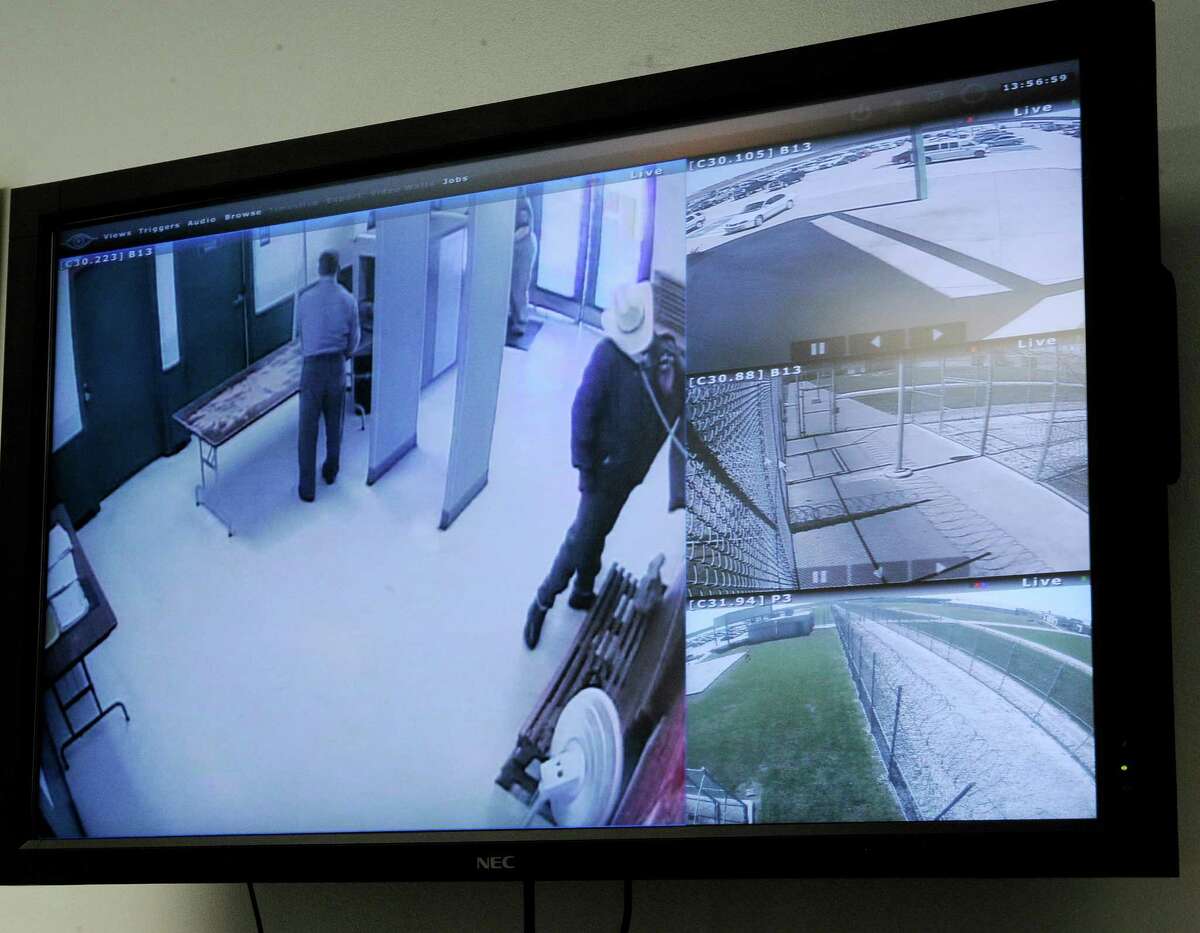 A screen in the warden's office at the Stiles Unit of the Texas Department of Criminal Justice displays view from different security cameras at the prison Wednesday, March 13, 2013, in Beaumont, Texas. New technology is being installed at the prison unit to divert calls, texts, emails and internet log-in attempts from contraband phones. (AP Photo/Pat Sullivan)