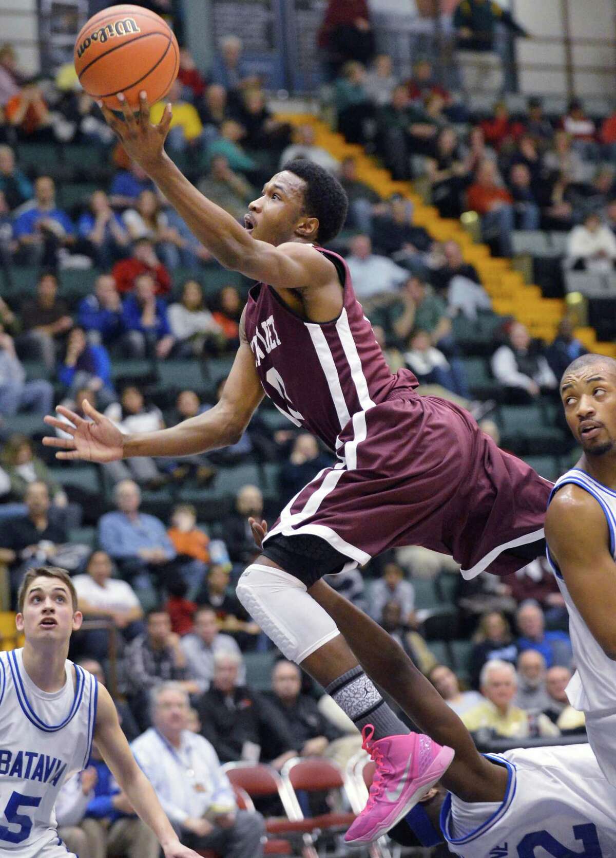 Watervliet's #10 Tyler McLeod drives to the basket against Batavia in the Class B semifinal at Glens Falls Civic Center Friday March 15, 2013. (John Carl D'Annibale / Times Union)