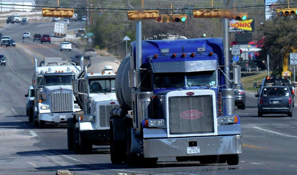 Truck traffic related to the Eagle Ford Shale energy boom travels through Kenedy, Texas, on Friday, March 15, 2013.