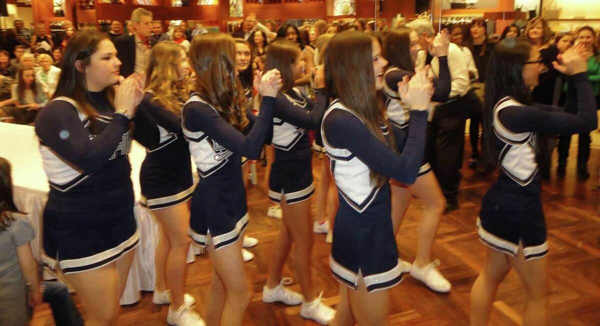 Always in style Staples cheerleaders 'vogue' for good causes