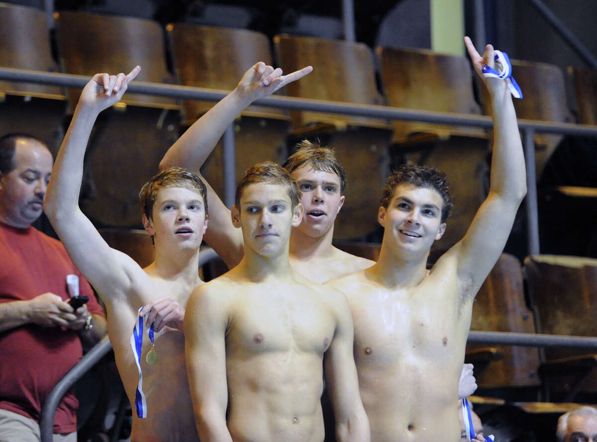 From left, Thomas Dillinger, Alex Lewis, Ben Wurst and Matthew Fraser, members of the Greenwich High School 400 yard freestyle relay, stand atop the winner's podium after they came in first in the event during the State Open swimming championships that Greenwich won at Yale University, New Haven, Conn., Saturday, March 16, 2013.