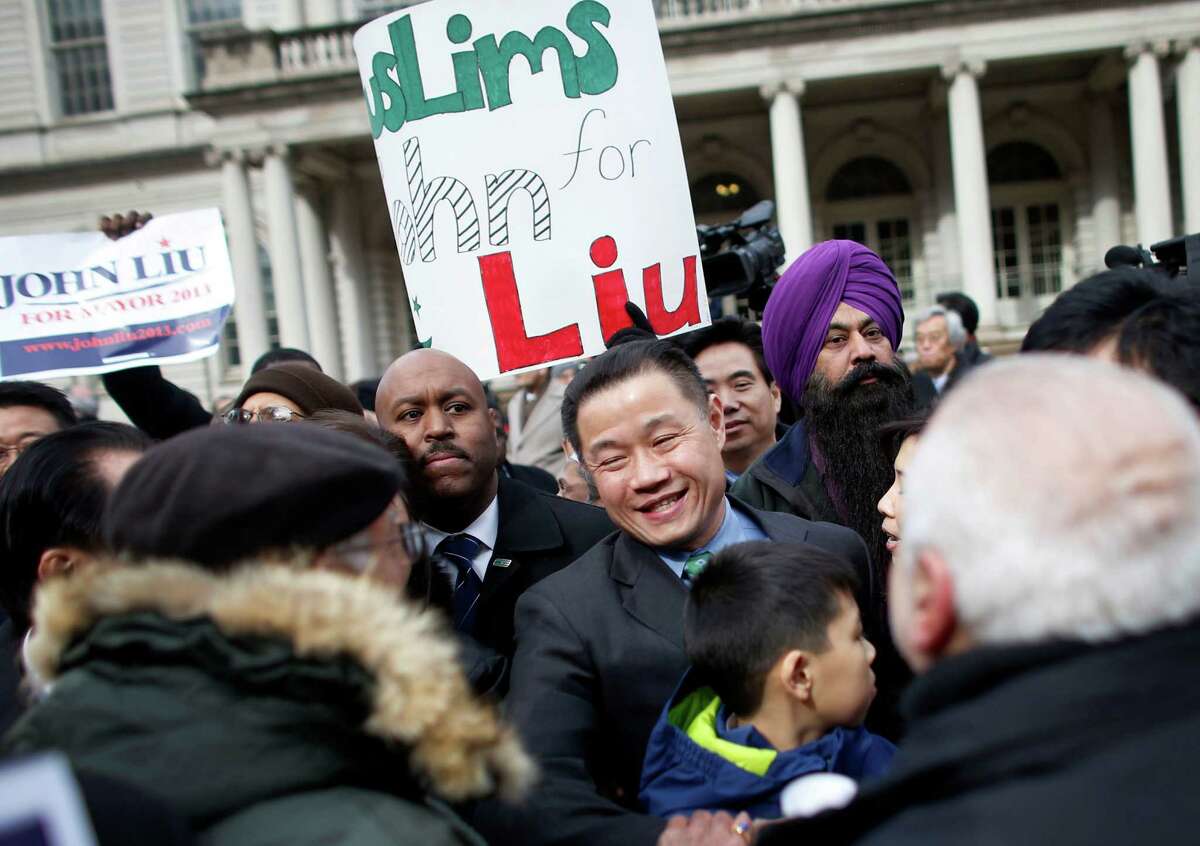 Then New York City Comptroller John Liu greets supporters after announcing the launch of his mayoral campaign on the steps of City Hall, Sunday, March 17, 2013 in New York. Liu is now poised to be the state's first Asian-American senator after his primary win in September 2018.   (AP Photo/Jason DeCrow)