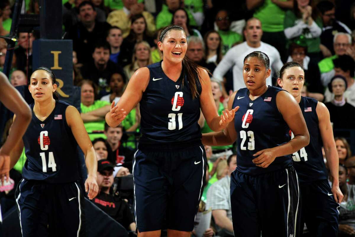 Connecticut forward Stefanie Dolson, middle, reacts to a foul call as teammates Bria Hartley left, and -Kaleena Mosqueda-Lewis, middle right, and Kelly Faris, far right, look on during action in a college basketball game Monday March 4, 2013 in South Bend, Ind. (AP Photo/Joe Raymond)