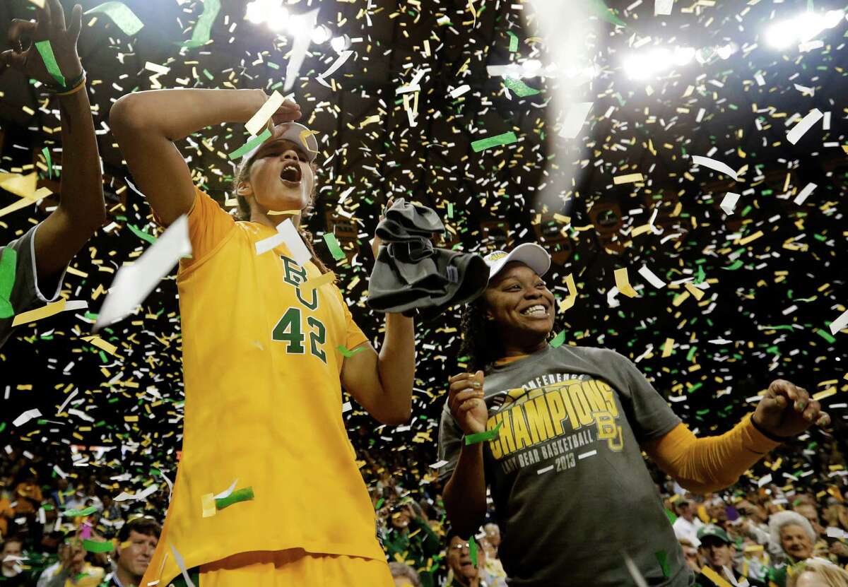 Baylor's Brittney Griner (42) and Odyssey Sims, right, celebrate their the Big 12 Conference title after they defeated Texas 67-47 in an NCAA college basketball game against Texas Saturday, Feb. 23, 2013, in Waco, Texas. (AP Photo/Tony Gutierrez)