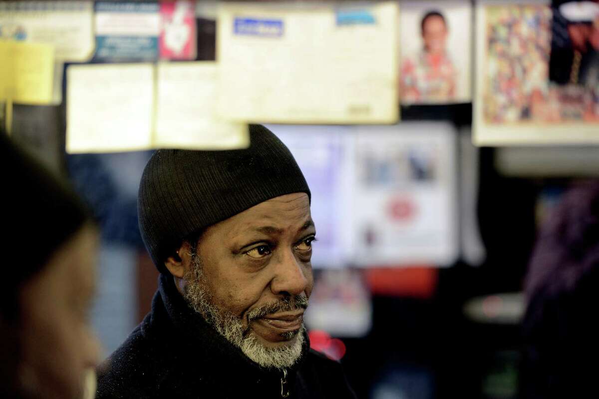 Willie Stancil Jr. is reflected in one of the mirrors of Stancil's Barbershop which was established in 1956 is still in full swing March 8, 2013, and may be one of the oldest barber shops on Albany, N.Y. (Skip Dickstein/Times Union)