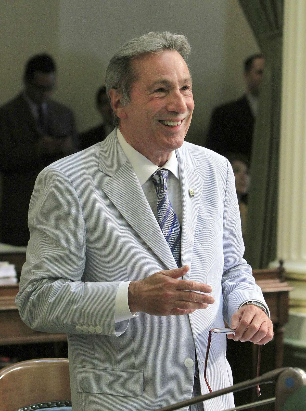 Assemblyman Tom Ammiano,D-San Francisco, smiles as his bill aimed at providing a framework for overseeing and regulating California's medical marijuana industry, was approved by the Assembly in Sacramento, Calif., Thursday, May 31, 2012. The measure AB2312, modeled after a ballot initiative that medical marijuana advocates crafted after the four federal prosecutors based in California launched a crackdown on dispensaries and growers, passed with the minimum number of 41 votes and sent to the Senate. (AP Photo/Rich Pedroncelli)