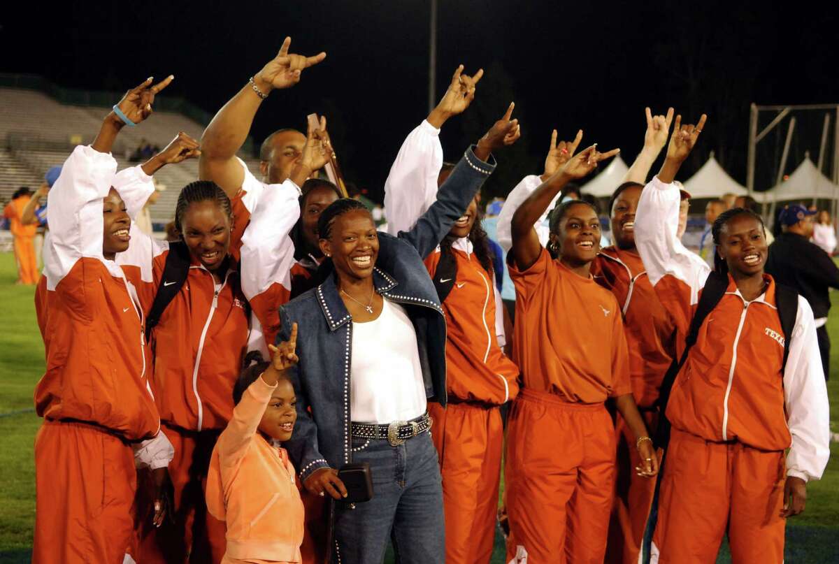 Texas women's coach Bev Kearney celebrates with team after the Longhorns won the team title in the NCAA Track & Field Championships at Sacramento State's Hornet Stadium in Sacramento, Calif. on Saturday, June 11, 2005.