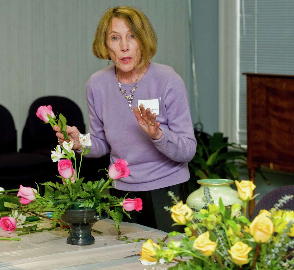 Pat Benkovich, a member of the Garden Club of Newtown and a winner of many ribbons in both creative design and horticulture, gives an arrangement demonstration to club members at the Newtown Library. Tuesday, Feb. 26, 2013