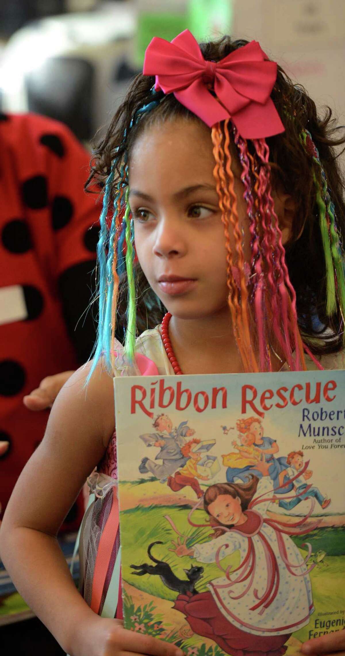Janelis Peralta-Rodriguez wears her "Ribbon Rescue" costume March 21, 2013, during "living Literature Day" as part of the week-long literacy celebration at the Delaware Community School in Albany, N.Y.(Skip Dickstein/Times Union)