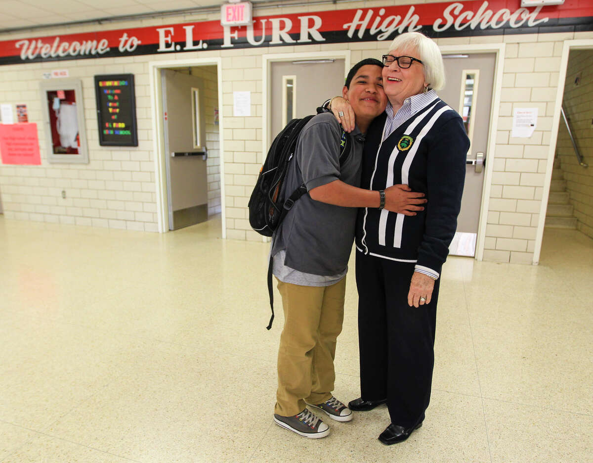 Dr. Bertie Simmons, 78, came out of retirement to rescue Furr High School, where her tough-love approach includes hallway hugs with students like Mario Moreno, 15.