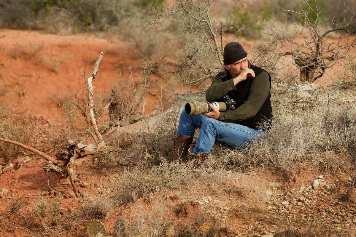 Texas photographer Wyman Meinzer uses a coyote call at the ranch where his father was a cowboy. (More: The state photographer has seen it all)