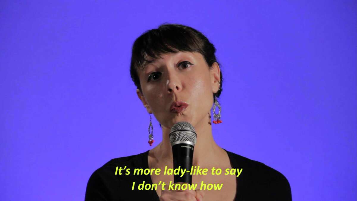 A still from a Julia Landois Barbosa video that is part of the exhibit "Bite Like a Kitty."