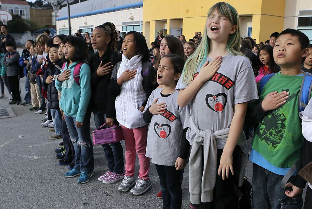 Students in Patricia Juri's 4th-grade class recite the Pledge of Allegiance during a bi-weekly assembly at Argonne Elementary School in San Francisco, Calif. on Friday, March 15, 2013.