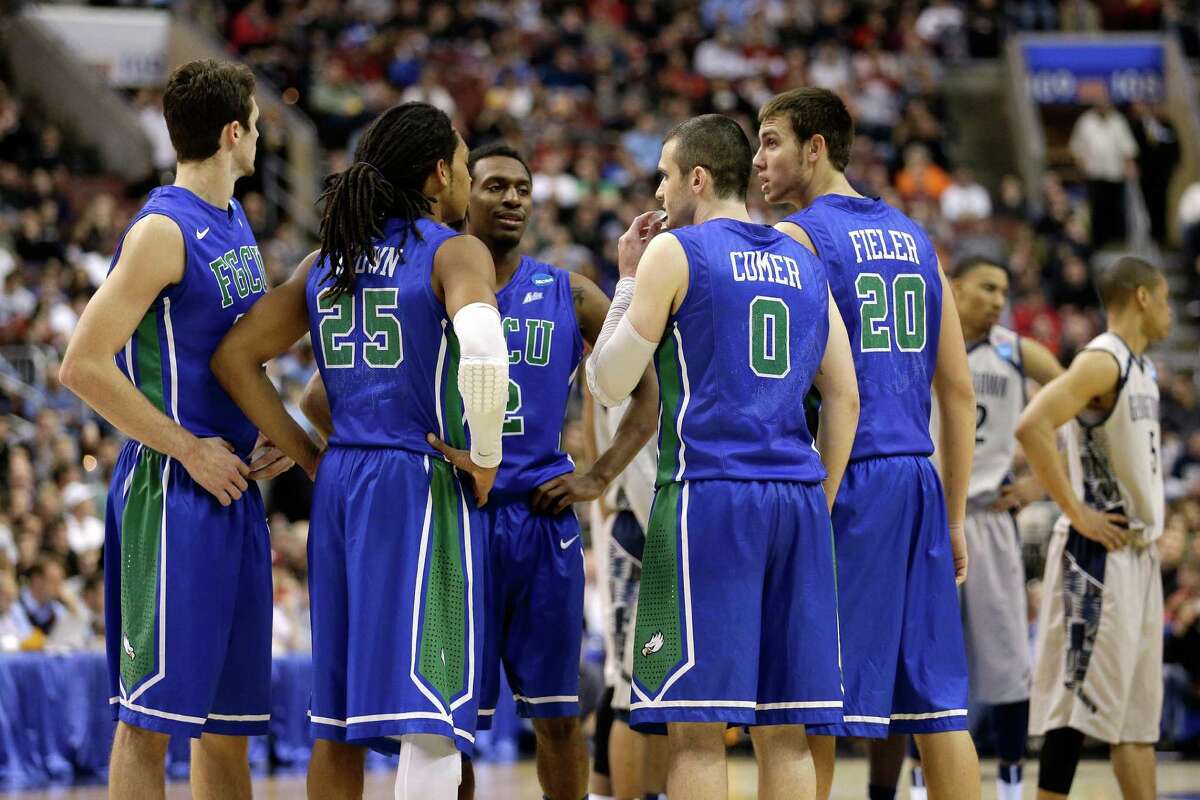Eddie Murray #23, Sherwood Brown #25, Bernard Thompson #2, Brett Comer #0 and Chase Fieler #20 of the Florida Gulf Coast Eagles huddle up in the second half against the Georgetown Hoyas.