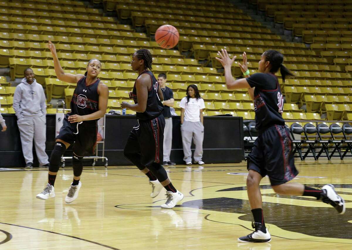 South Carolina's Tiffany Mitchell, left, Aleighsa Welch, center, and Sancheon White work on a fast break during practice for a first-round game in the women's NCAA college basketball tournament in Boulder, Colo., Friday, March 22, 2013. South Carolina will play South Dakota State on Saturday. (AP Photo/Ed Andrieski)
