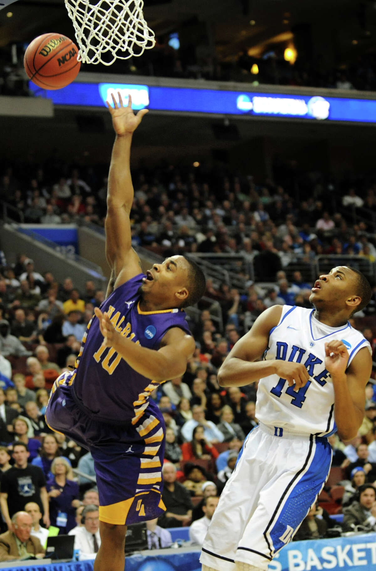UAlbany's Mike Black, left, shoots for the hoop as Duke's Rasheed Sulaimon defends in the second round NCAA Tournament on Friday, March 22, 2013, at Wells Fargo Center in Philadelphia, Penn. (Cindy Schultz / Times Union)