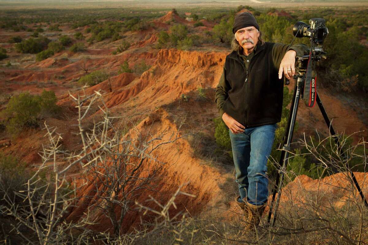Wyman Meinzer, pictured against the sweep of the Knoco Badlands in West Texas, is usually on the other side of the camera.