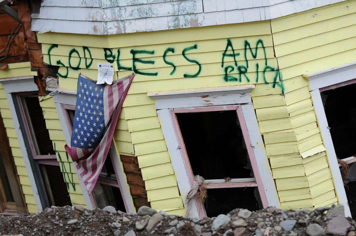 View of graffiti on a devastated home on Thursday, Nov. 17, 2011 in Prattsville, N.Y., destroyed by flooding from Tropical Storm Irene. (Philip Kamrass / Times Union )