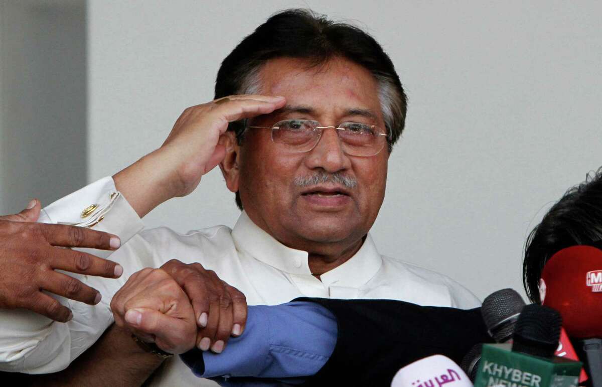 Former Pakistani President Pervez Musharraf, salutes the crowd, upon his arrival to Karachi airport, Pakistan, Sunday, March 24, 2013. Former Pakistani President Pervez Musharraf ended more than four years in self-exile Sunday with a flight to his homeland, seeking a possible political comeback in defiance of judicial probes and death threats from Taliban militants. (AP Photo/Shakil Adil)