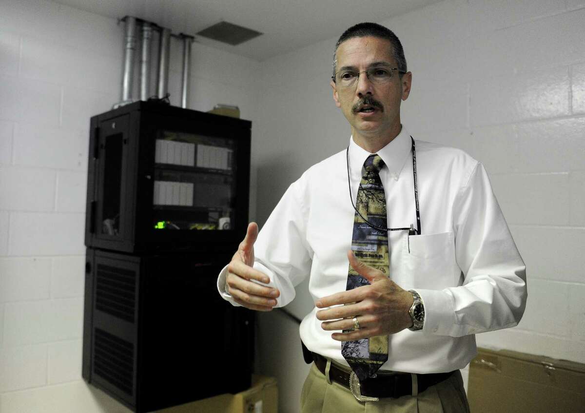 Senior Warden Michael Roesler discusses a cell phone blocking system being installed at the Stiles Unit of the Texas Department of Criminal Justice.
