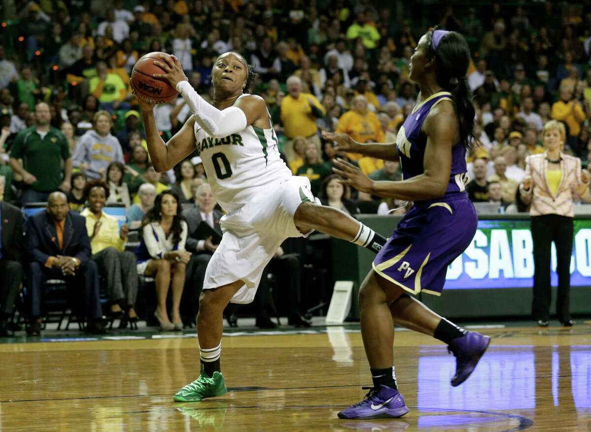 Baylor guard Odyssey Sims (0) prepares for a shot against Prairie View A&M guard LaReahn Washington, right, in the secod half of a first-round game in the women's NCAA college basketball tournament Sunday March 24, 2013, in Waco, Texas. (AP Photo/Tony Gutierrez)