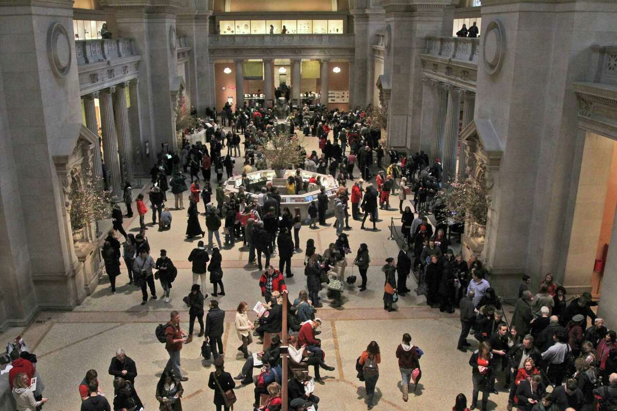 In this Tuesday, March 19, 2013 photo visitors to the Metropolitan Museum of Art in New York congregate in the main lobby. (AP Photo/Mary Altaffer)