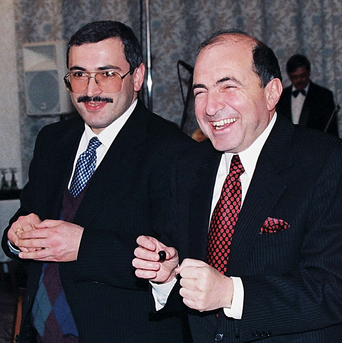 In this undated file photo, Boris Berezovsky, right, and Mikhail Khodarkovsky, two of Russia's most prominent tycoons, smile at a reception in Moscow.