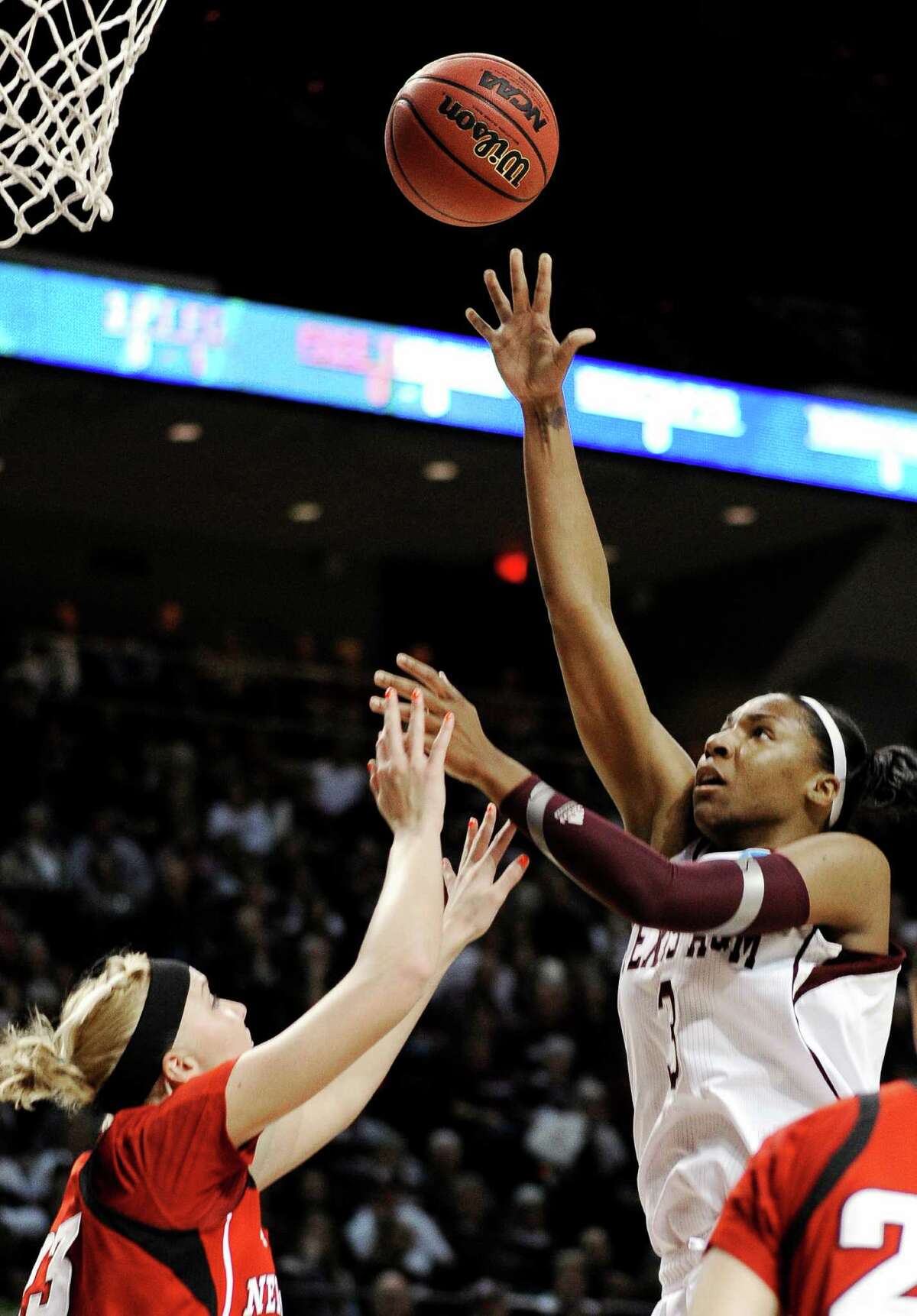 Texas A&M's Kelsey Bone (3) shoots over Nebraska's Emily Cady (23) during a second-round game in the NCAA women's college basketball tournament in College Station, Texas, Monday, March 25, 2013.